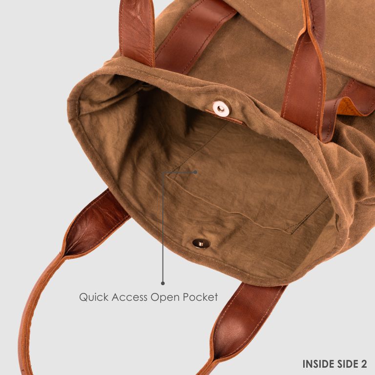Brown backpack with leather straps on a light gray background